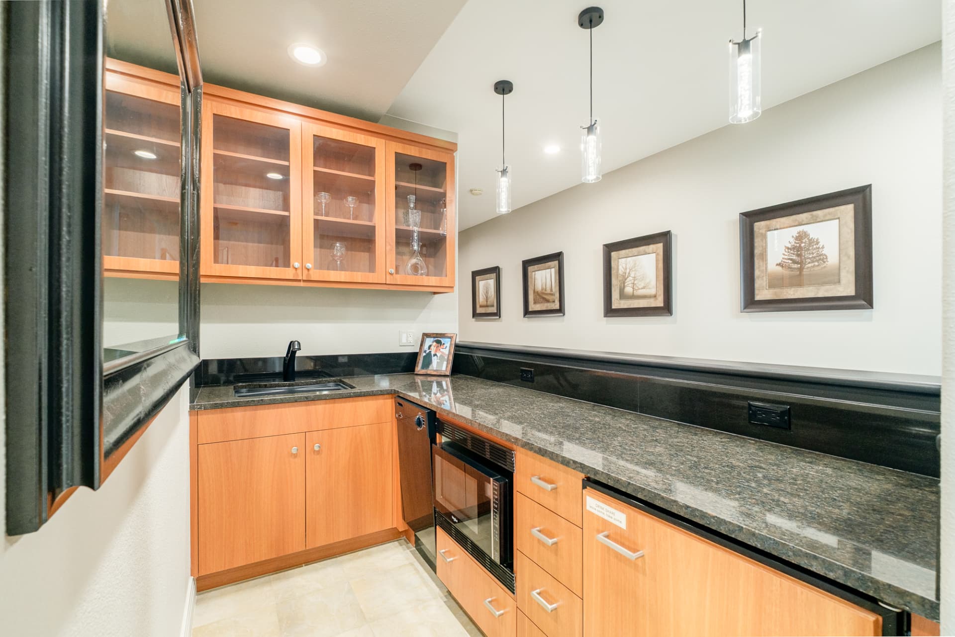 Lower level wet bar in dark wood