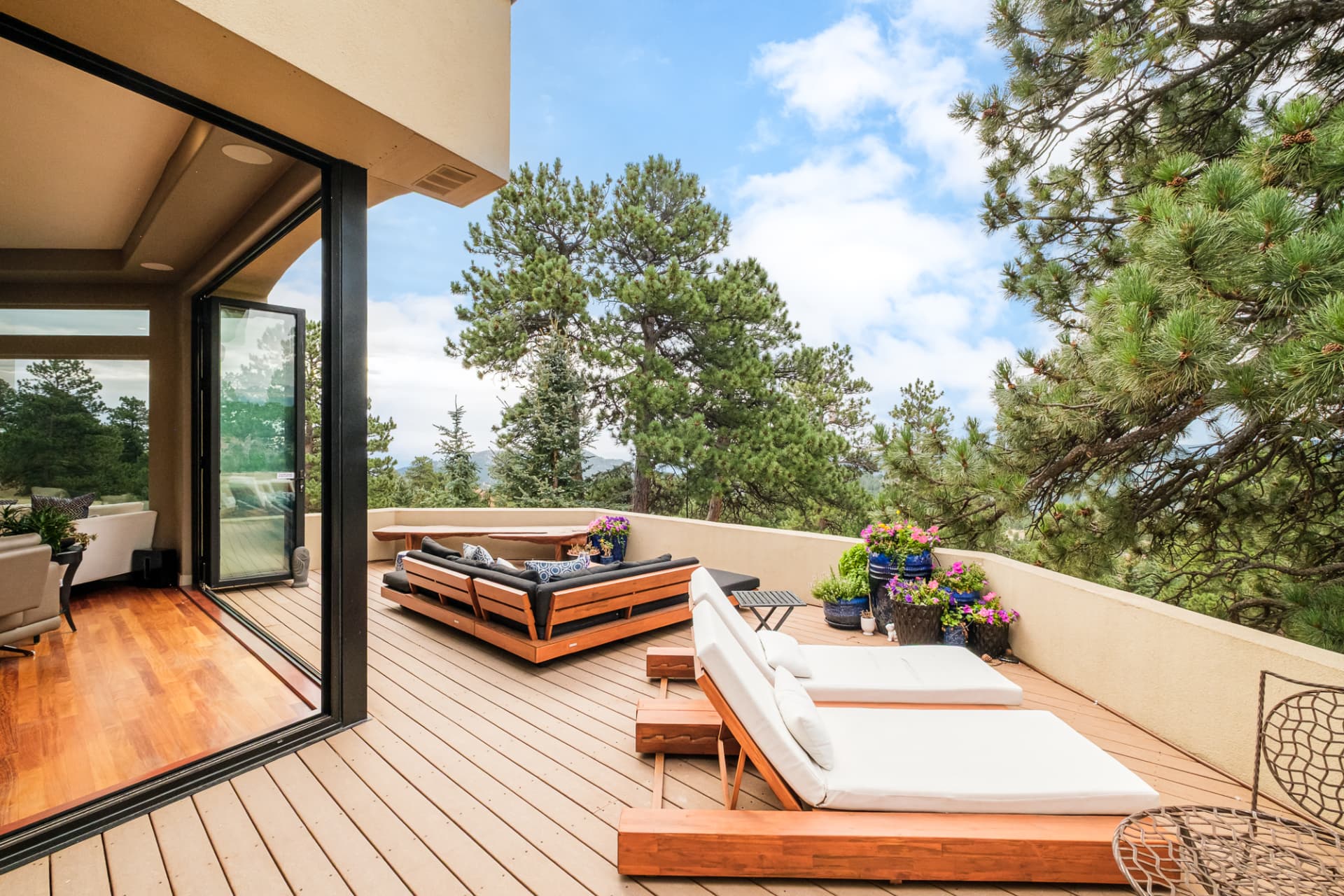 Folding glass doors open from the great room to the deck