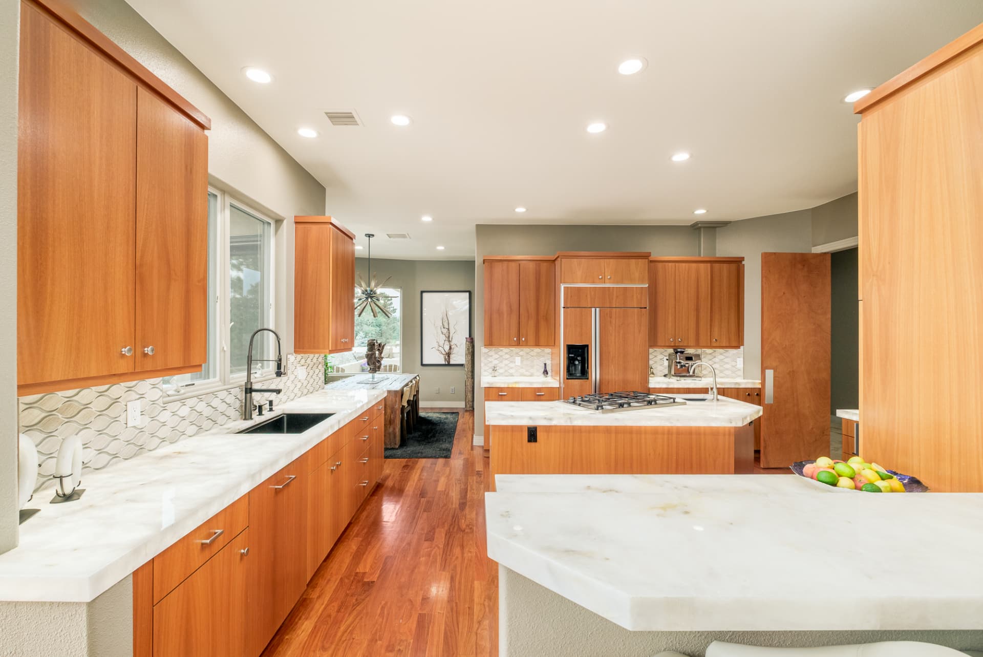 Chef's kitchen with light wood cabinetry