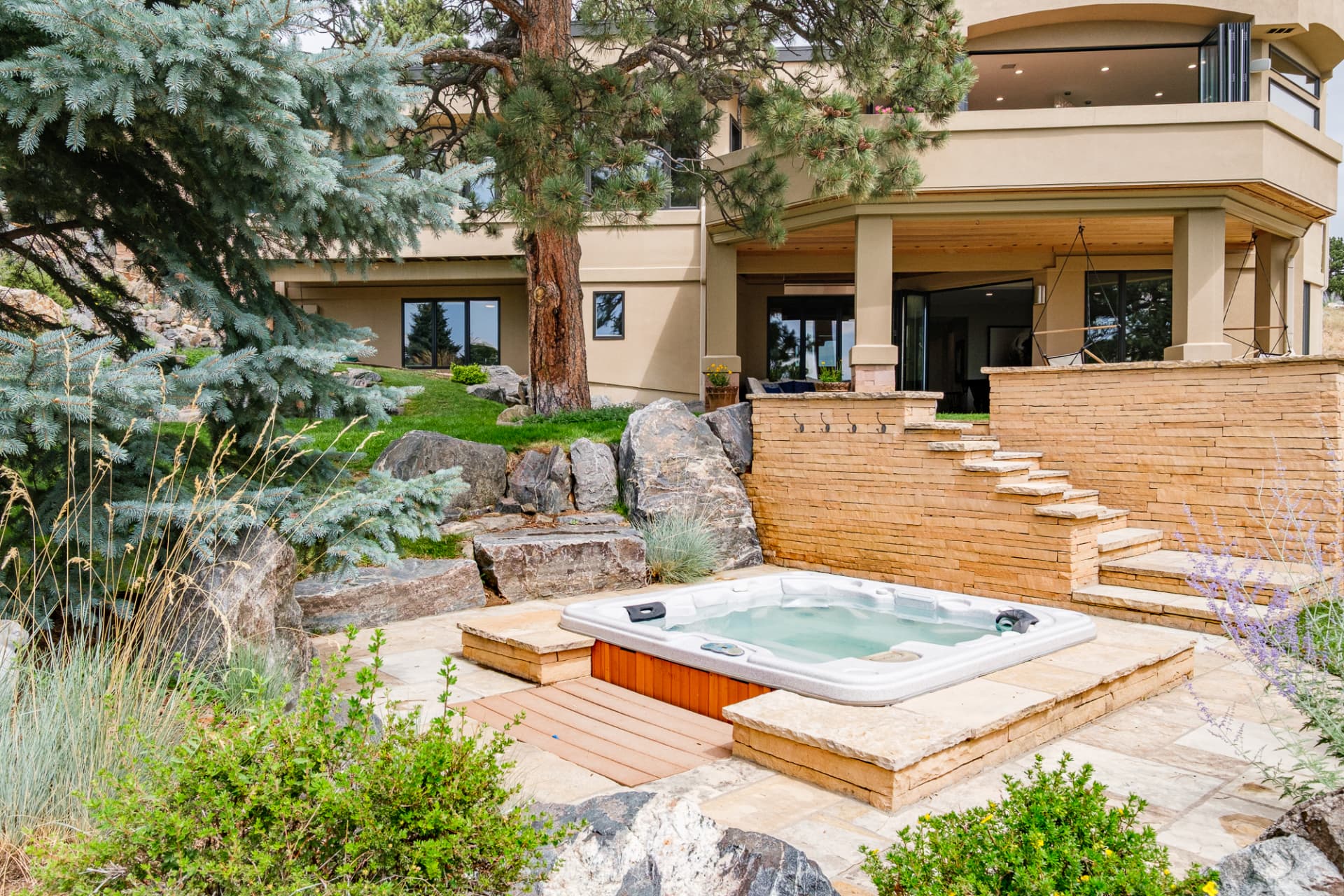 Hot tub set into the stone terrace