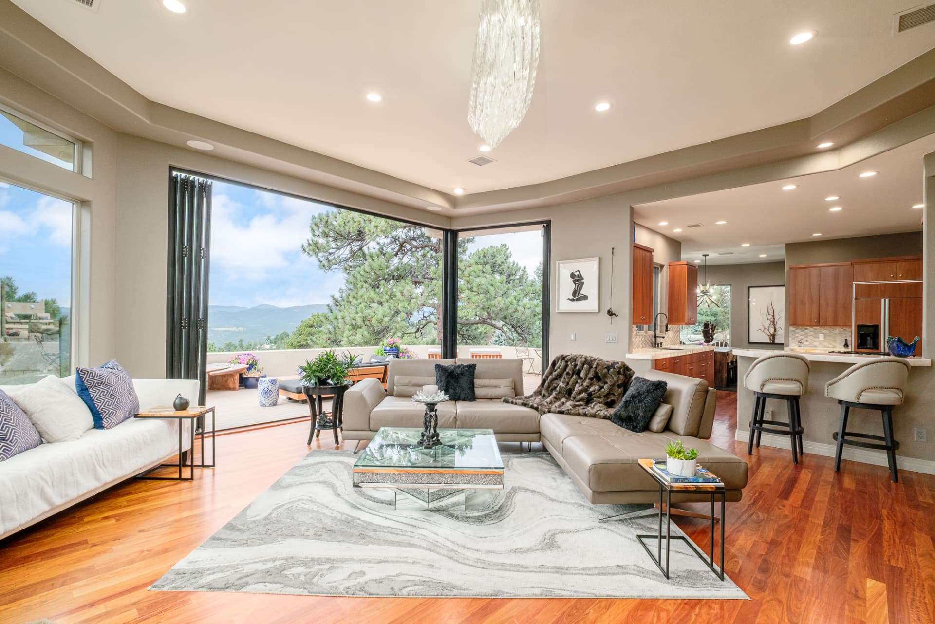 Great room opening into the kitchen with folding glass doors