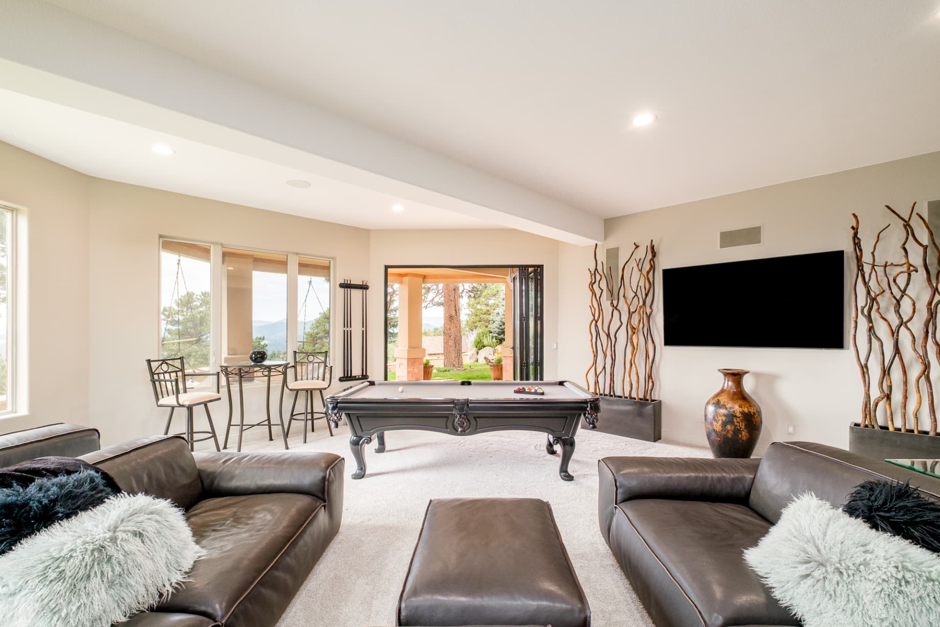 Lower level entertainment room with billiards table