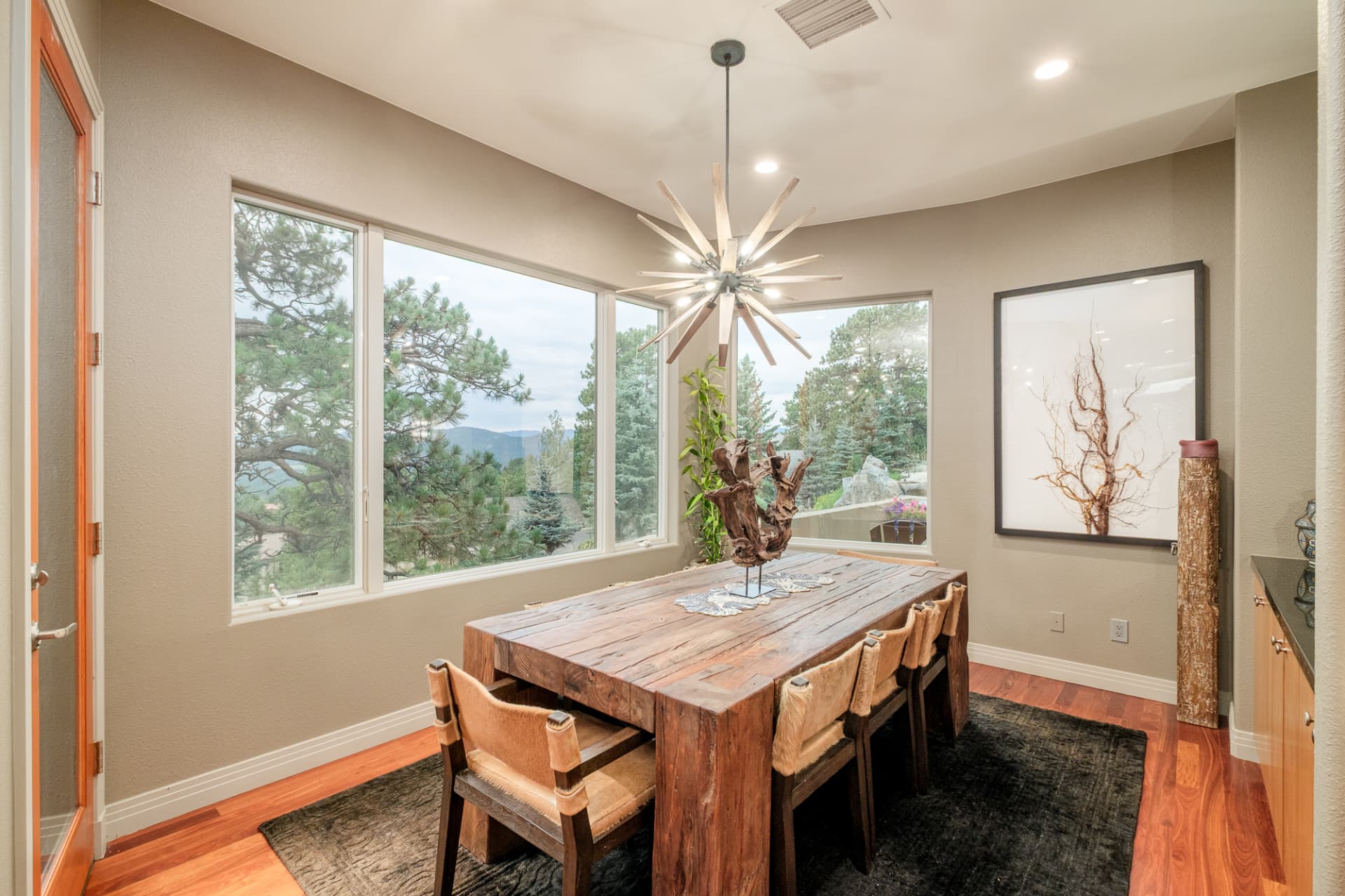 Dining nook with a rustic wood table